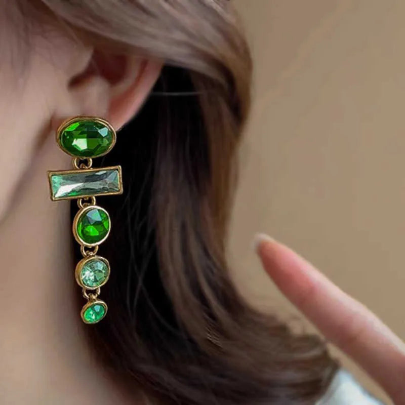Green zircon and gradient tassel geometric alloy earrings in a retro Chinese style.