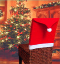 Set of red and white Christmas chair covers featuring Santa Claus, Snowman, and Santa Hat designs on dining chairs.