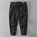 Men's casual cotton overalls in khaki with an elasticated waistband, shown in a loose fit.