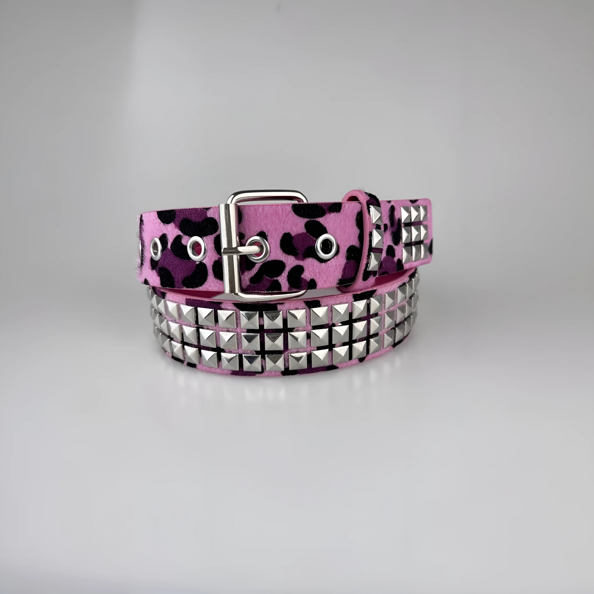 Women's punk fashion belt with metal decorative rivets in pyramid stud patterns including brown leopard, white zebra, and rose red leopard options
