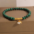 Women's adjustable lucky bamboo bracelet with white crystal detailing on wrist