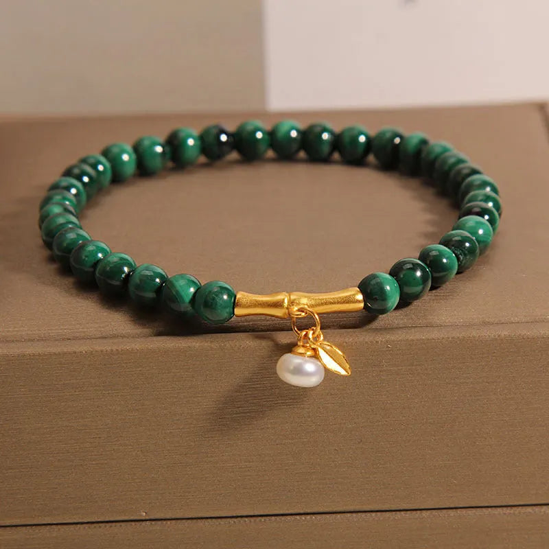 Women's adjustable lucky bamboo bracelet with white crystal detailing on wrist