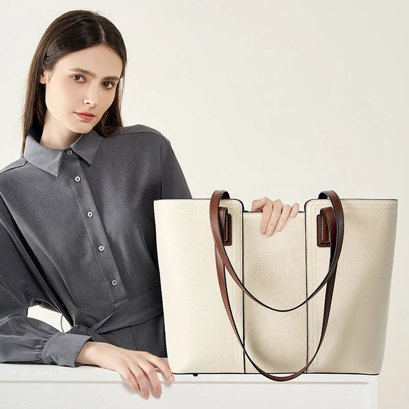 Black genuine leather women's shoulder bag showing internal organiser pockets and crossbody strap