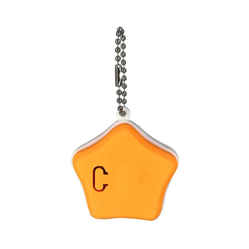 Blue and orange silicone rechargeable pendant light for pet collars, showing LED on.