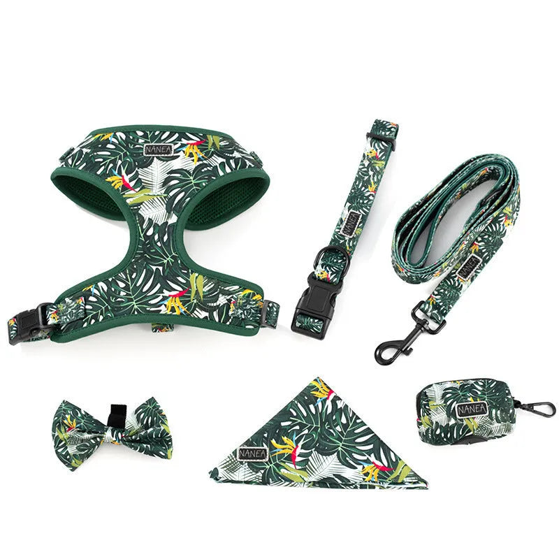 Adjustable cloth vest dog harness and lead six-piece set with collar, bow tie, scarf, and waste bag dispenser.