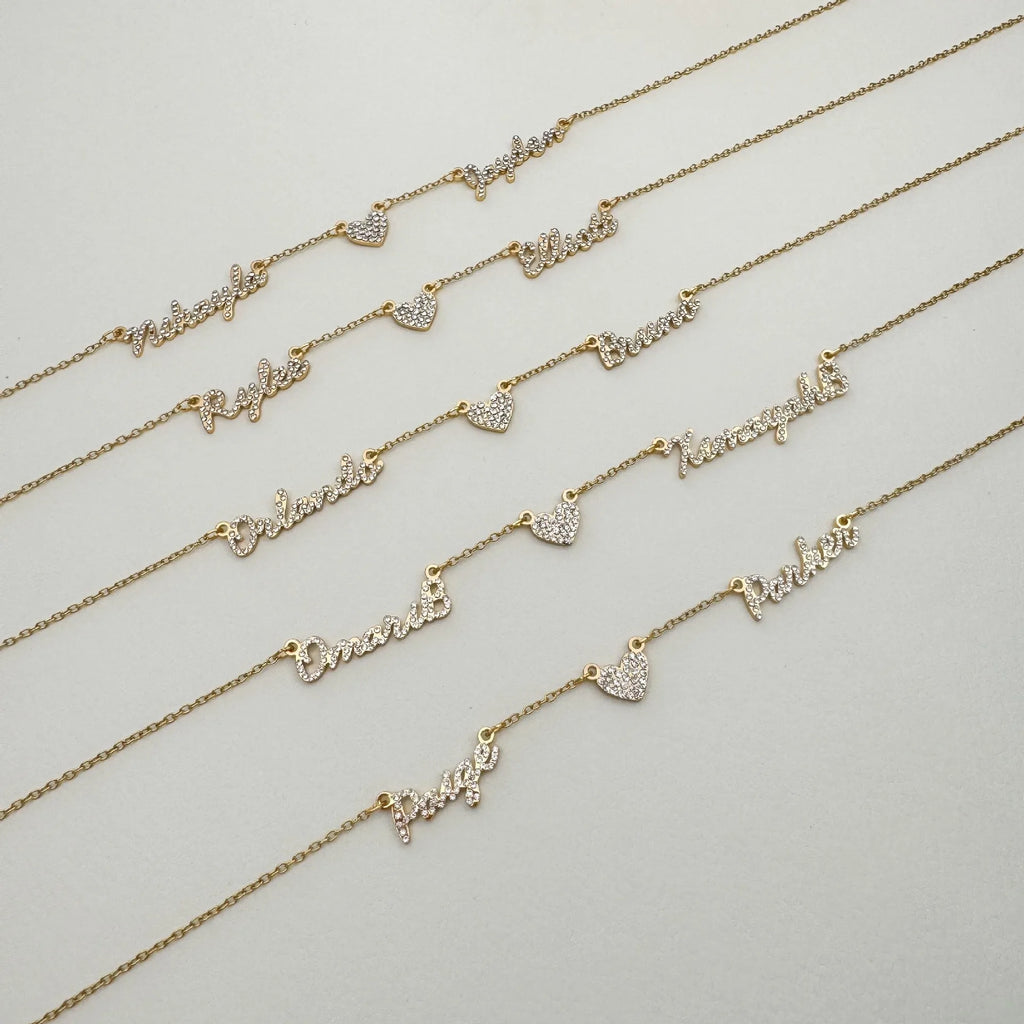 Customised diamond inlaid multi name necklace on stainless steel O-shaped chain, gold finish, with heart charms