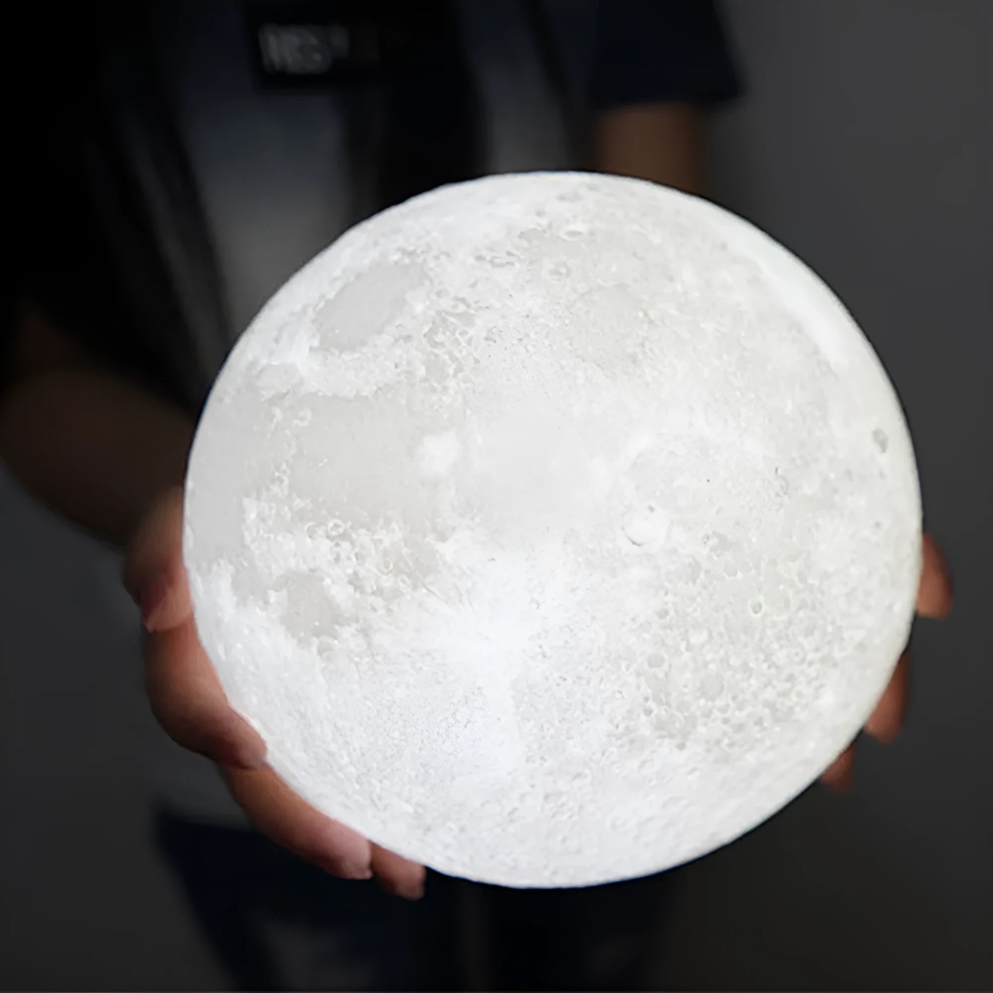 3D-printed white moon lamp on wooden stand with touch-sensitive metal ring base