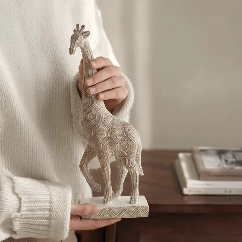 European style wood colour resin giraffe decorative ornament on a surface.