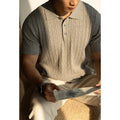 Men's khaki short-sleeve business top on a hanger, showing front design.