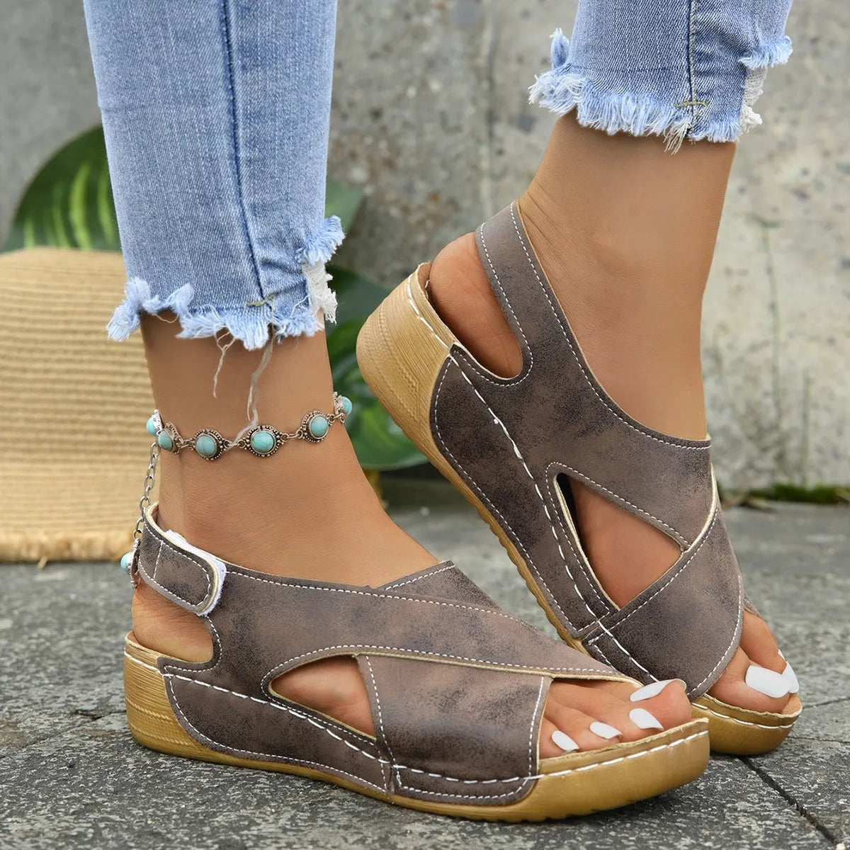 Women's brown platform sandals with a decorative skirt and Velcro strap fastening.