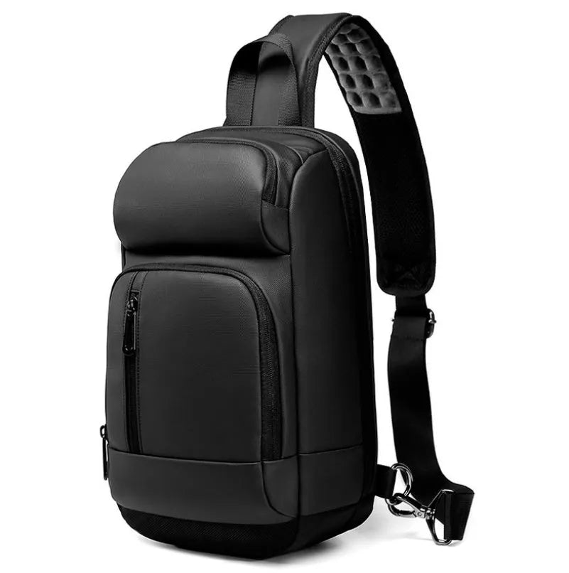 Black PVC outdoor shoulder bag with a square shape, showing the air cushion strap and front pocket.