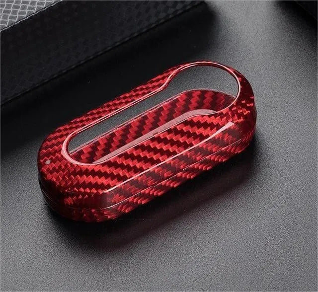 Carbon fibre and glass fibre car key replacement shell set showing black, red, and silver black colour options