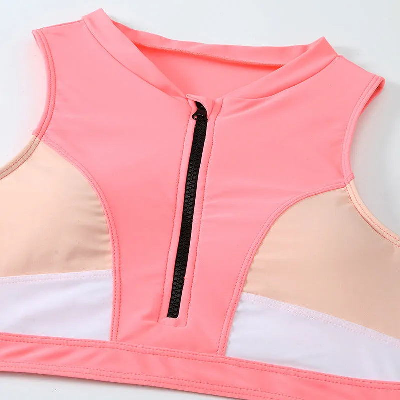 Pink high waist bikini set with split briefs design on a mannequin.