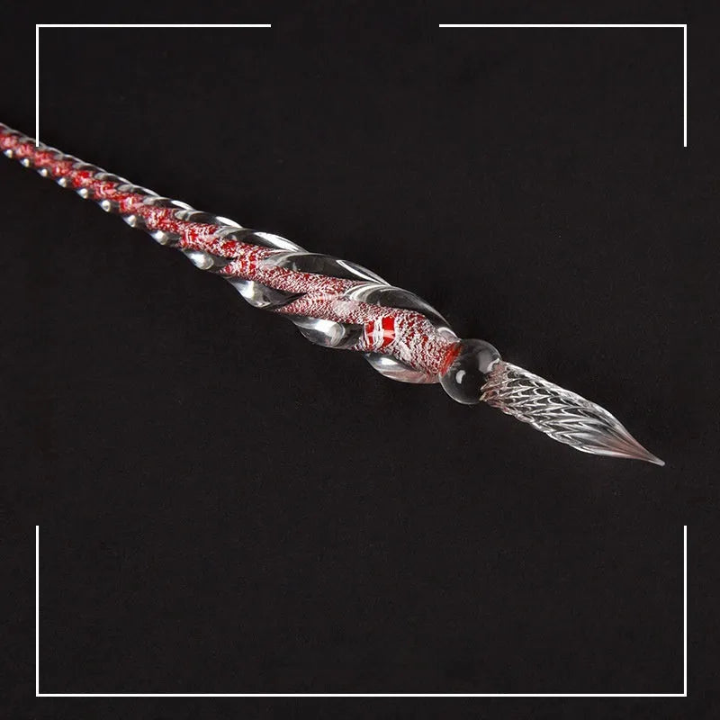 Transparent coloured glaze crystal pen in a gift box, showing abstract glass design.