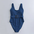 Navy blue women's one-piece slimming triangle swimsuit with chest pads on mannequin