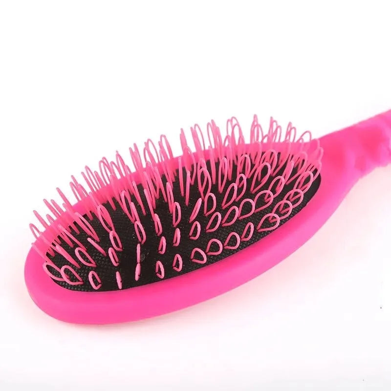 Black ring tooth hair extension comb on a white background, showing its 22cm length.