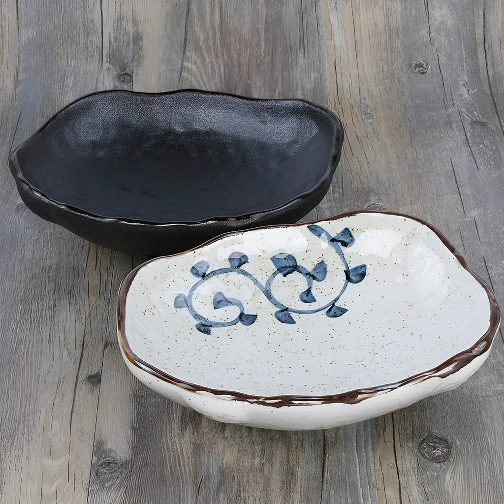 Japanese-style ceramic sashimi bowl with irregular shape and floral decoration