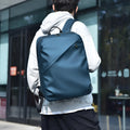 Men's waterproof PU backpack in black with simple sewing thread design and separate computer compartment.