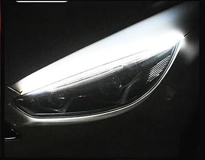 Car LED daytime running light strip with flowing turn signal function in silicone housing