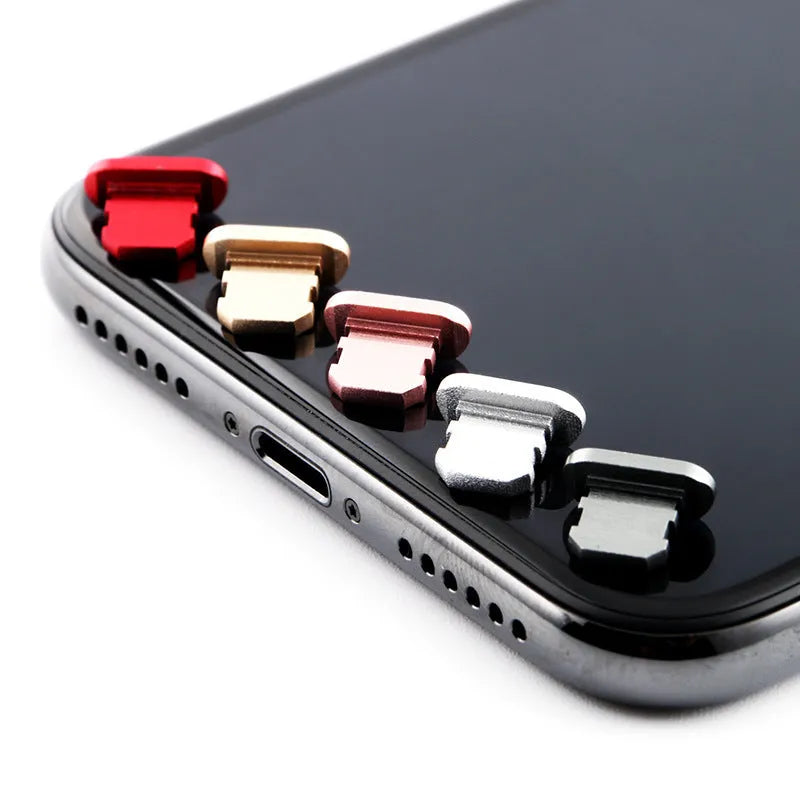 Aluminium alloy dust plug for iPhone charging port in various colours including gold, silver and rose gold.