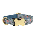 Flat nylon dog collar with grid print and a metal bone-shaped buckle.