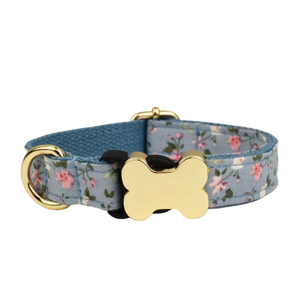 Flat nylon dog collar with grid print and a metal bone-shaped buckle.