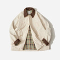 Green casual polyester jacket with long sleeves and side seam pockets on a hanger.