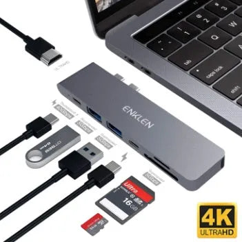 Silver aluminium USB-C hub adapter with SD card slot, HDMI, USB ports, and Thunderbolt 3 connector.