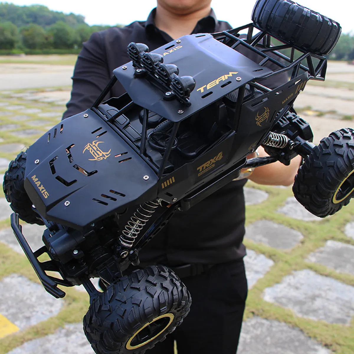 Large black 4WD remote control climbing car with 2.4G wireless controller