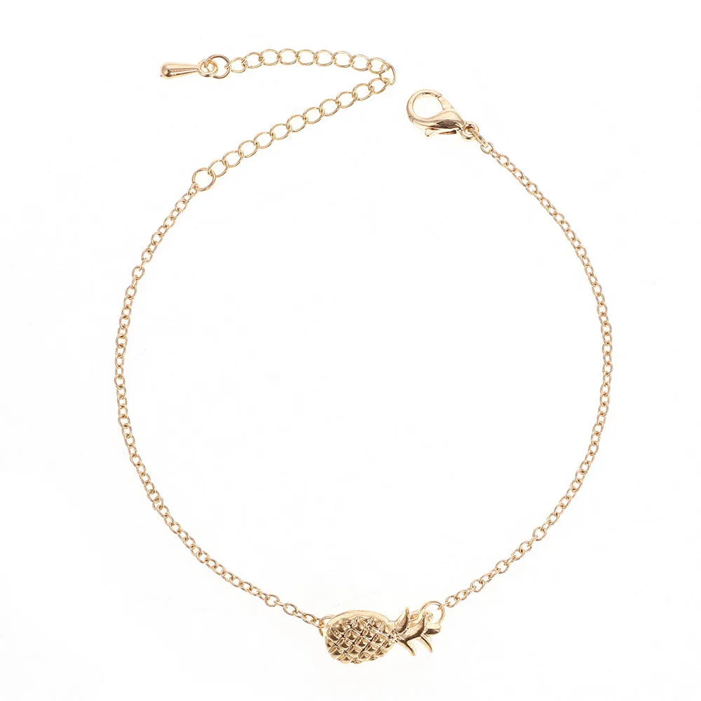 Women's alloy bracelet with a detailed pineapple charm in gold or silver tone.