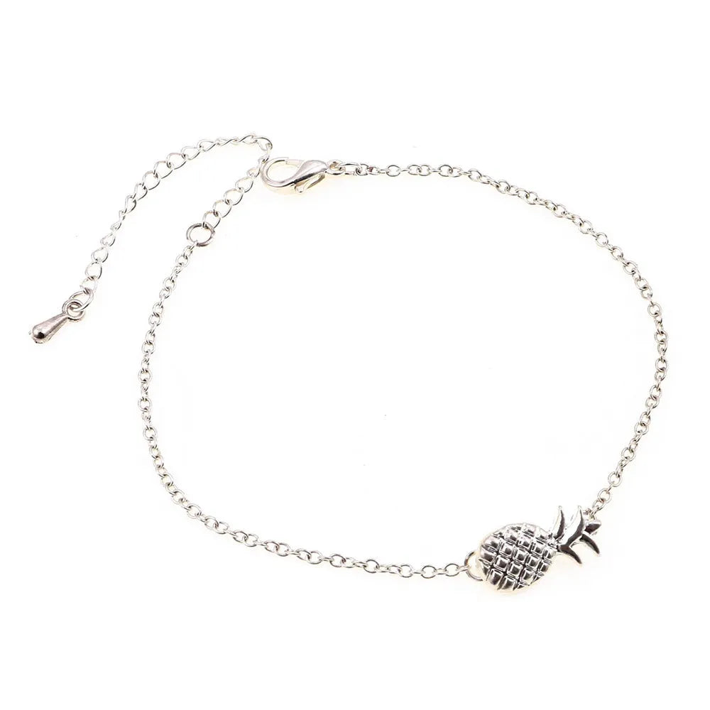 Women's alloy bracelet with a detailed pineapple charm in gold or silver tone.