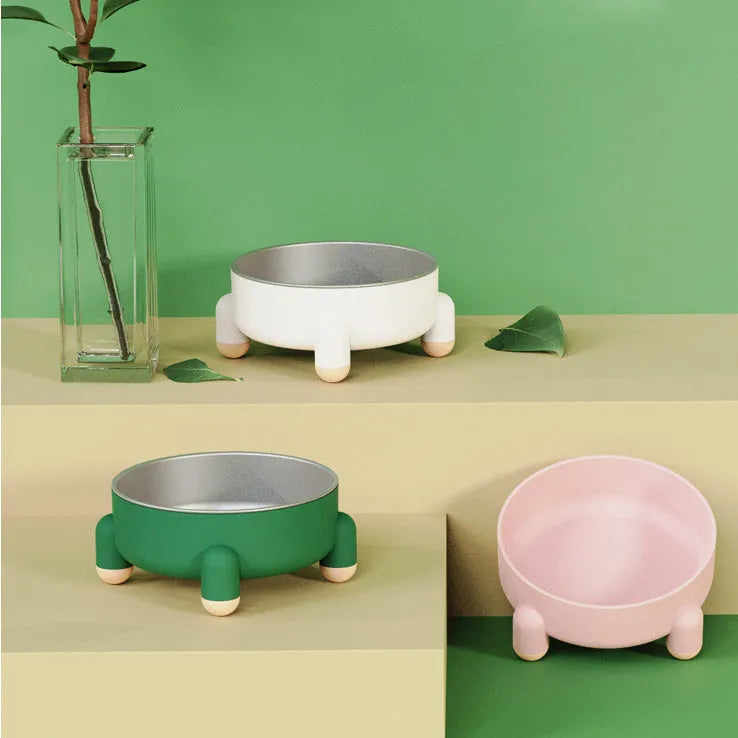 Green stainless steel pet bowl with non-slip base and raised feet for dogs and cats.