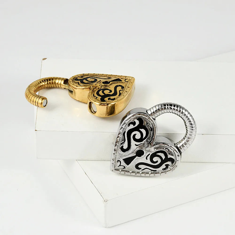 A pair of heart-shaped stud earrings in stainless steel with a choice of gold or steel electroplated colour.