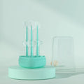Soft silicone pet toothbrush for dogs and cats in blue, green, and purple colours for cleaning teeth and reducing bad breath.