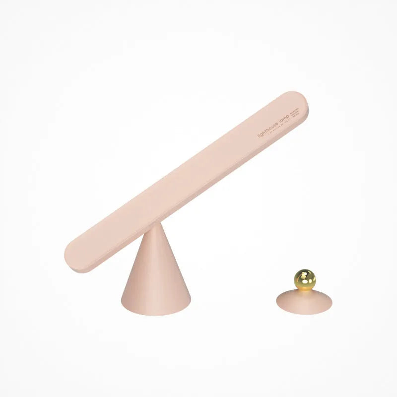 White geometric desk lamp with magnetic suction base and touch control on wooden desk