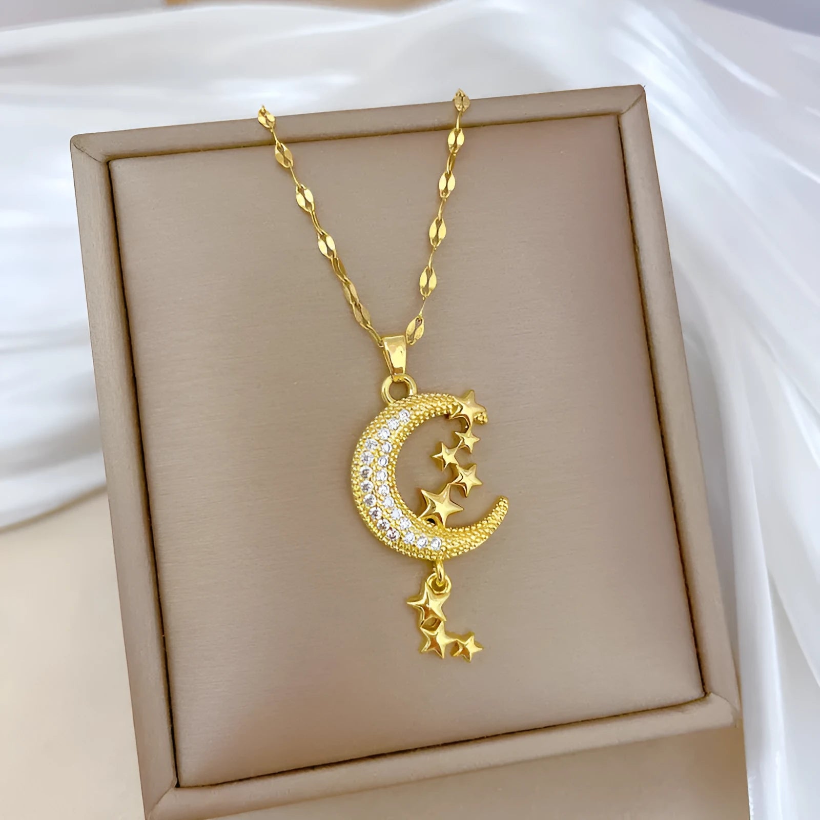 Moon pendant necklace with geometric tassel design and full diamond setting