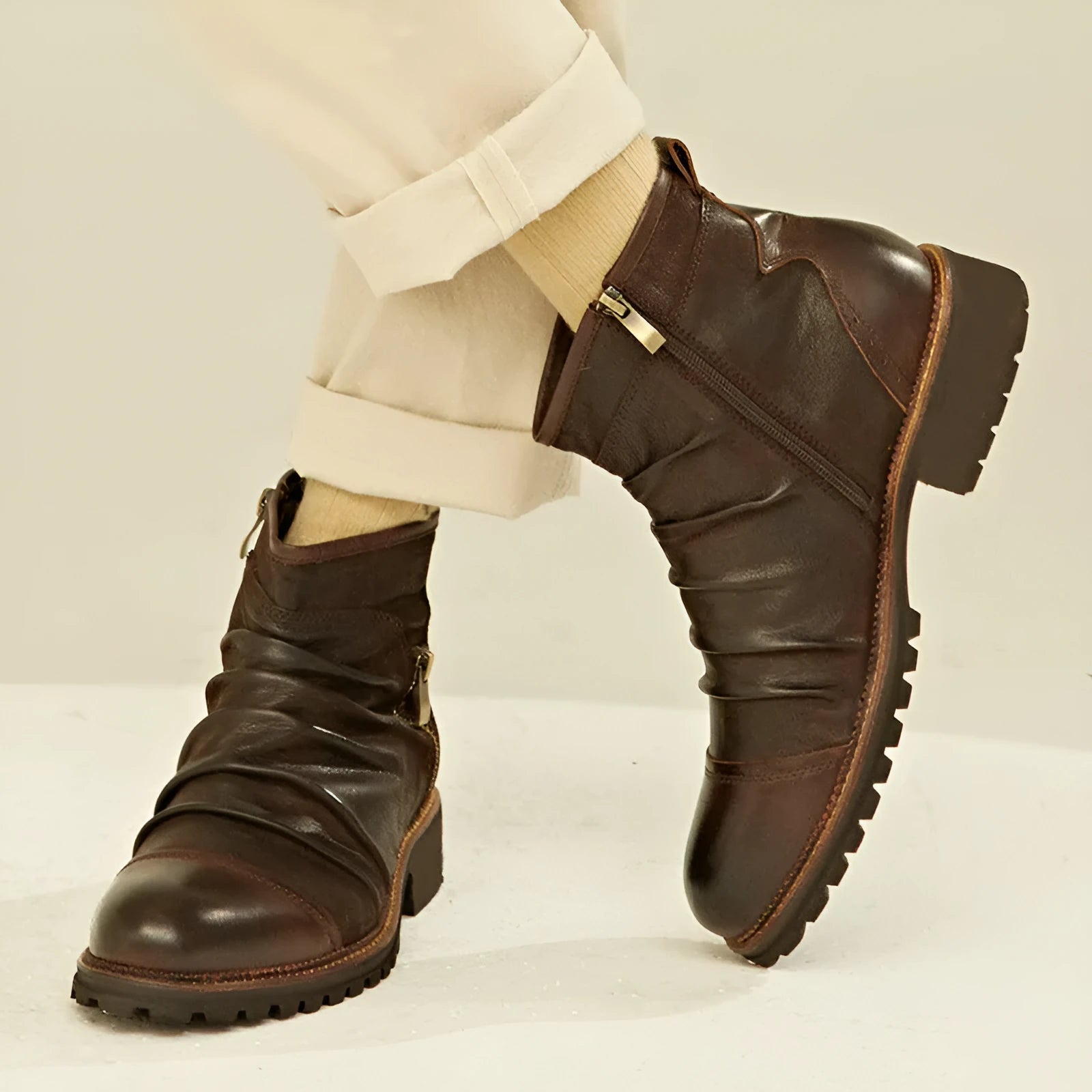 Men's black cowboy boots with side zipper, embossed texture, round toe, and a medium horseshoe heel.