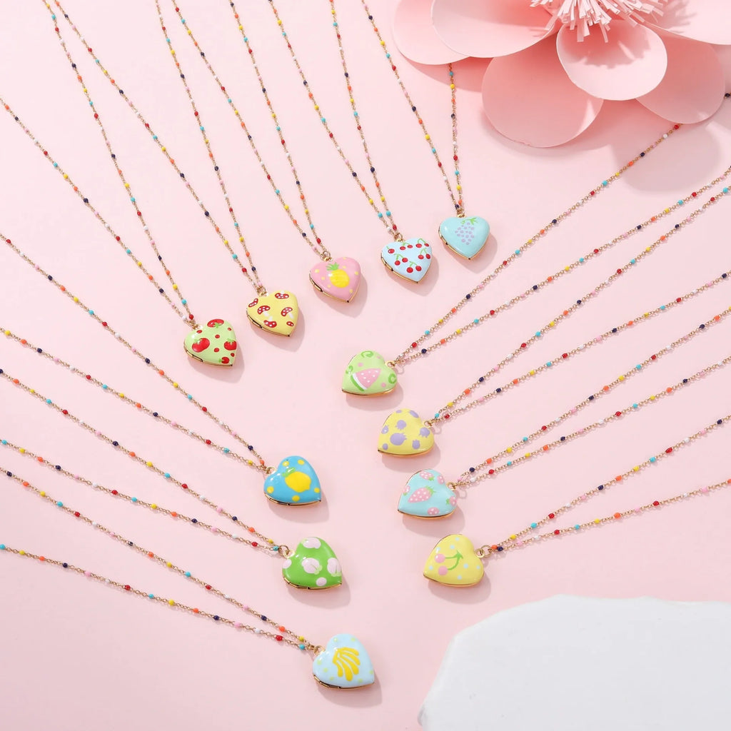 Gold plated fruit charm necklace with heart-shaped pendant on adjustable stainless steel chain