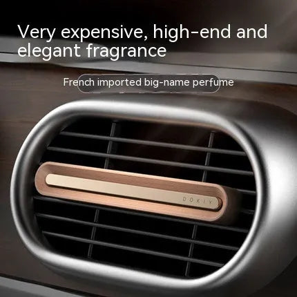 Car aromatherapy ornament in long strip design for air vent placement in walnut wood or metallic grey colour