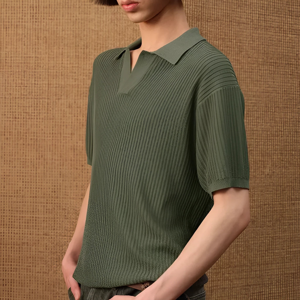 A creamy-white loose-fit polo shirt with a striped collar and short sleeves on a hanger.