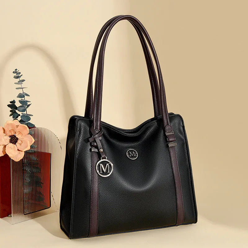 Genuine leather women's crossbody bag in retro style showing horizontal square shape and double shoulder straps.