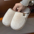 PVC plush winter slippers in a solid colour with a non-slip sole for indoor wear.
