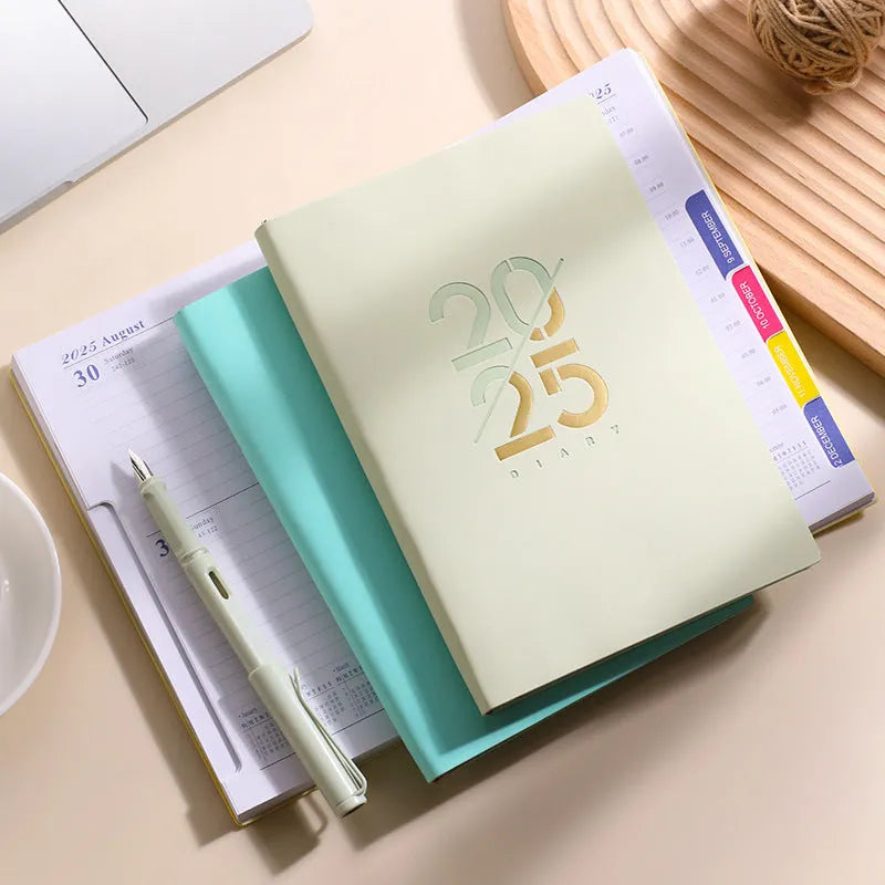A5 daily planner book with soft faux leather cover in blue colour option showing open pages