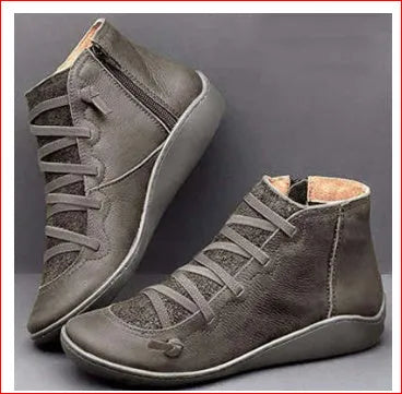 Women's black casual booties with wedge heel and round toe on rubber sole