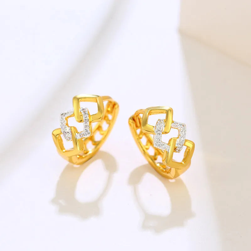 Gold geometric hollow-out earrings with colour separation detail on ear clip