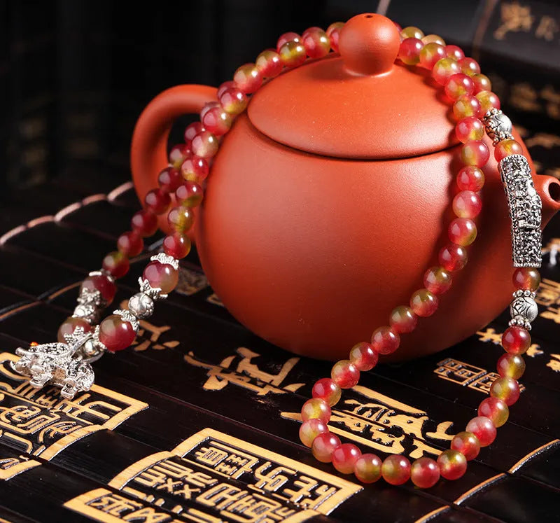 Handmade Chinese knot bracelet with natural watermelon crystal beads in traditional design