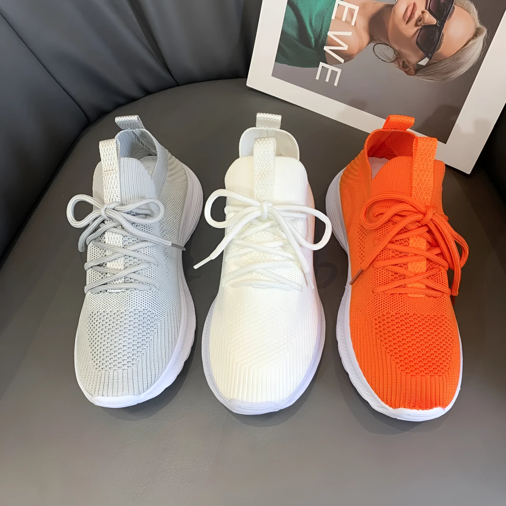 Women's low-top running shoes in creamy white with mesh and Flyknit breathable upper.