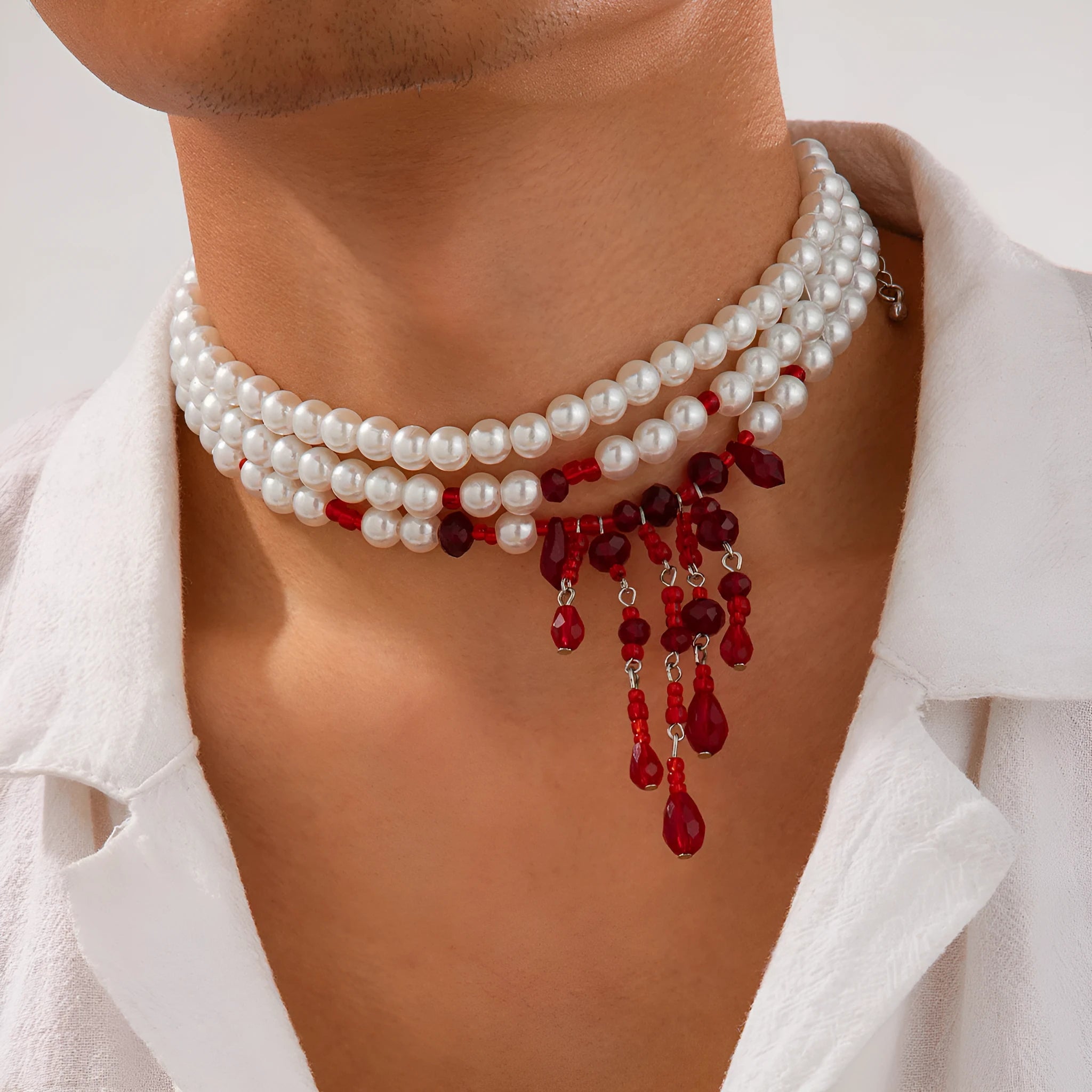 Men's Halloween necklace with red and black crystal blood drop pendant and pearl tassels on an adjustable chain