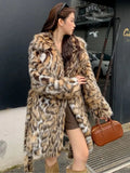 Women's faux fur coat with a large fur collar in a street fashion style.