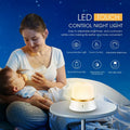 White bedside touch control night light with motion sensor, shown with warm white glow.